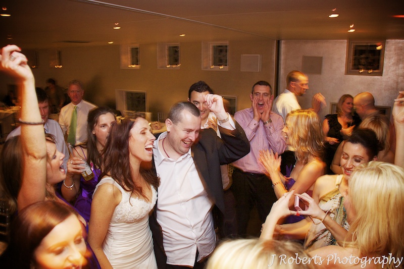 Bride and her brother on the dance floor = wedding photography sydney